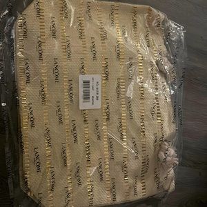 lancôme gold and beige beach bag